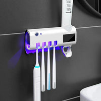 Electric toothbrush sterilizer and dispenser features