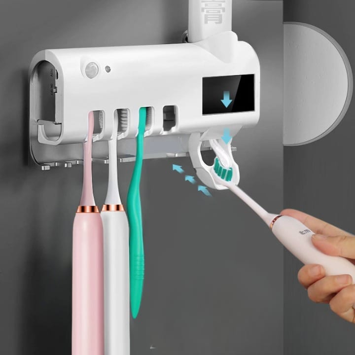 Electric toothbrush sterilizer and dispenser with UV light holder